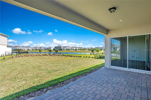 13231 Panama Beach Ct, Orlando, FL 32827 - view of patio / terrace featuring a residential view and a water view