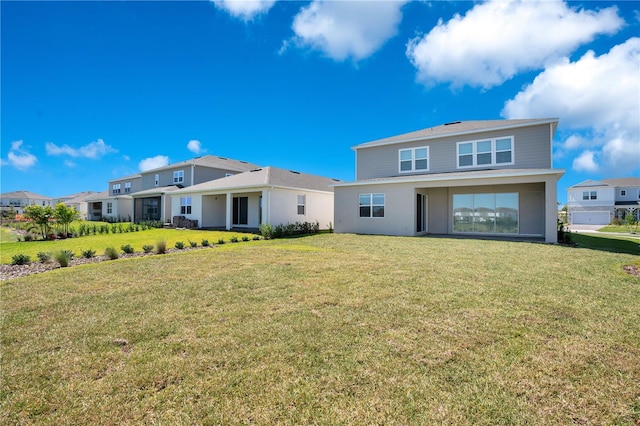13231 Panama Beach Ct, Orlando, FL 32827 - rear view of property featuring a lawn and stucco siding