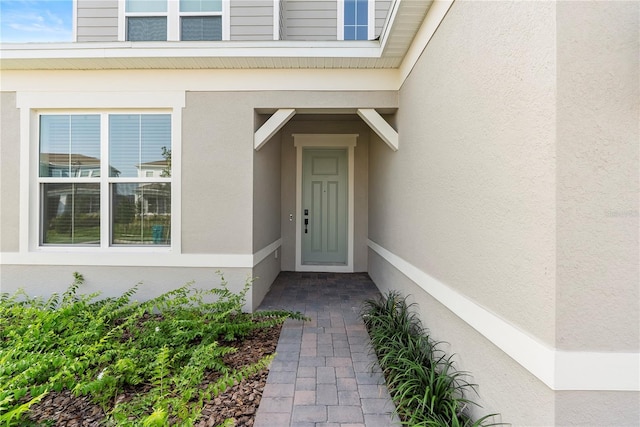 13231 Panama Beach Ct, Orlando, FL 32827 - view of exterior entry with stucco siding