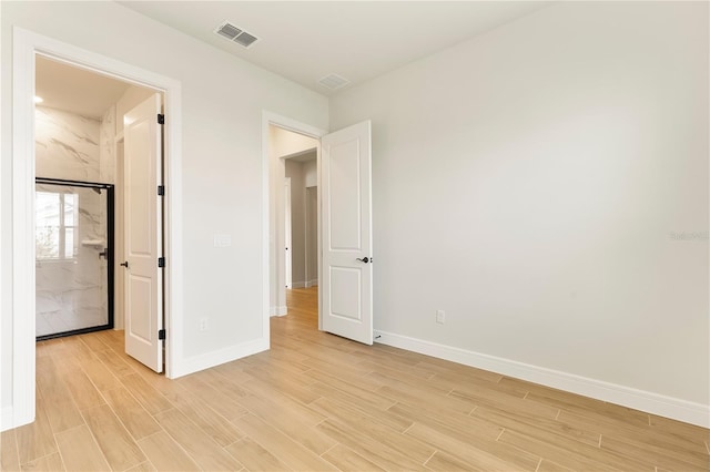 13231 Panama Beach Ct, Orlando, FL 32827 - unfurnished bedroom featuring light wood-style floors and baseboards