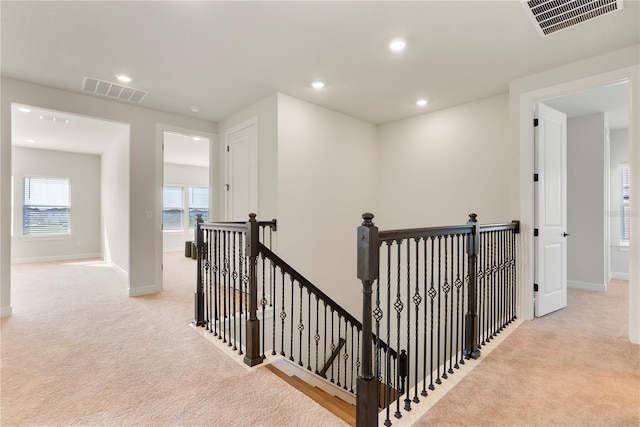 13231 Panama Beach Ct, Orlando, FL 32827 - corridor with an upstairs landing, carpet floors, baseboards, and recessed lighting