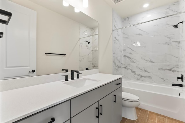 13231 Panama Beach Ct, Orlando, FL 32827 - full bath with vanity, washtub / shower combination, toilet, wood tiled floors, and recessed lighting