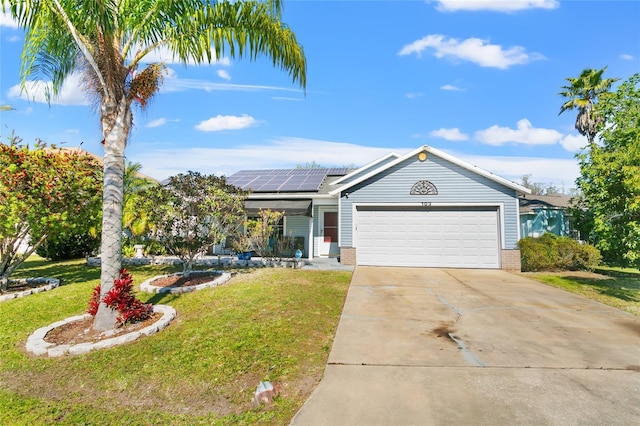 103 Nassau Pl, Kissimmee, FL 34758 - single story home featuring an attached garage, driveway, a front lawn, brick siding, and solar panels