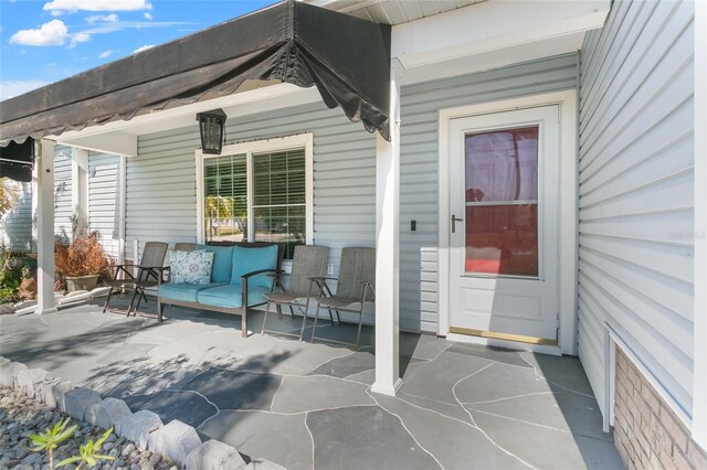 103 Nassau Pl, Kissimmee, FL 34758 - view of patio featuring an outdoor hangout area