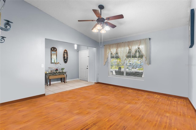 103 Nassau Pl, Kissimmee, FL 34758 - interior space with a ceiling fan, baseboards, lofted ceiling, and light wood finished floors