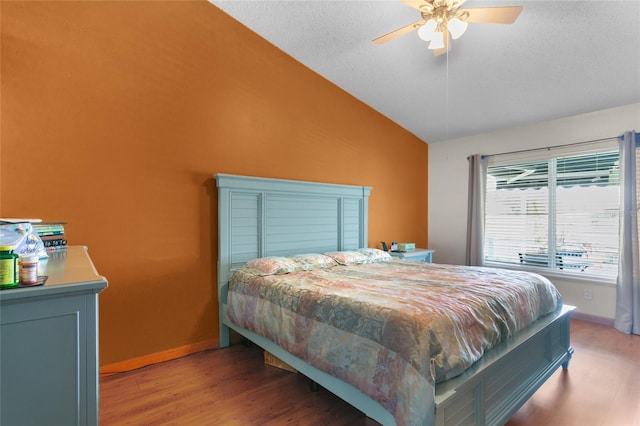 103 Nassau Pl, Kissimmee, FL 34758 - bedroom featuring vaulted ceiling, a ceiling fan, a textured ceiling, light wood-type flooring, and baseboards