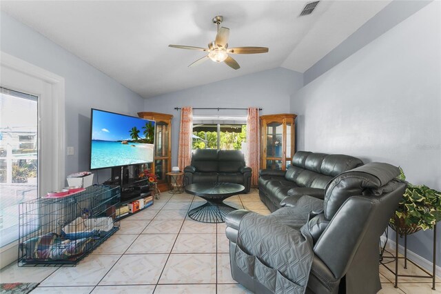 103 Nassau Pl, Kissimmee, FL 34758 - living room with visible vents, baseboards, tile patterned floors, a ceiling fan, and vaulted ceiling