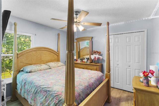 103 Nassau Pl, Kissimmee, FL 34758 - bedroom featuring a closet, wood finished floors, ceiling fan, and a textured ceiling