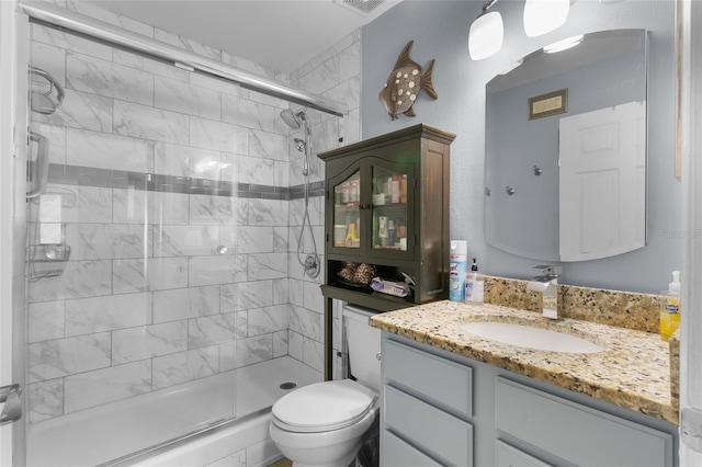 103 Nassau Pl, Kissimmee, FL 34758 - bathroom with toilet, vanity, tiled shower, and visible vents
