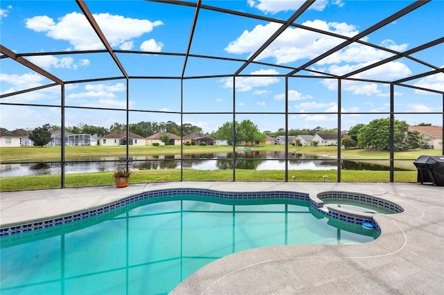 view of swimming pool featuring a pool with connected hot tub, a lanai, a water view, and a patio area