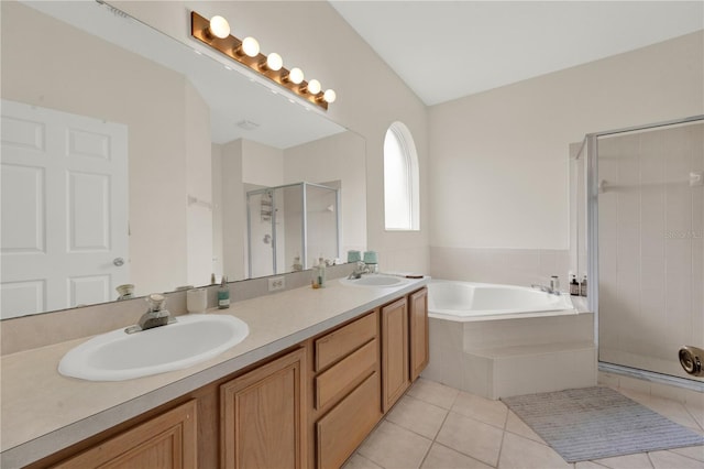 full bathroom with double vanity, a sink, a stall shower, and a bath