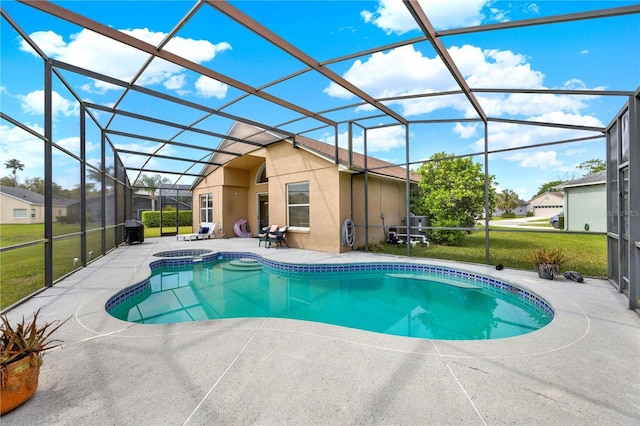 outdoor pool featuring glass enclosure, a lawn, and a patio area