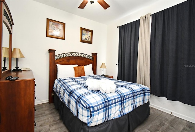 bedroom featuring wood finished floors and ceiling fan
