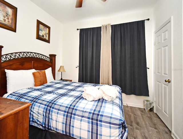 bedroom featuring wood finished floors and ceiling fan