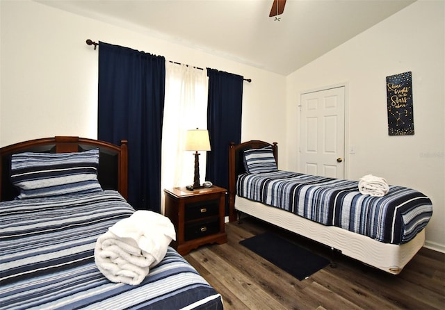 bedroom with wood finished floors, vaulted ceiling, and a ceiling fan