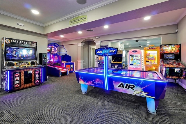 playroom with crown molding, decorative columns, carpet, arched walkways, and visible vents