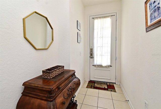 tiled entryway with baseboards