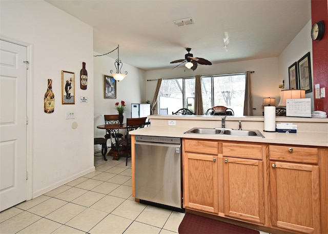kitchen featuring light countertops, a sink, dishwasher, visible vents, and ceiling fan