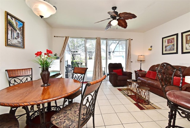 dining space featuring ceiling fan and light tile patterned floors