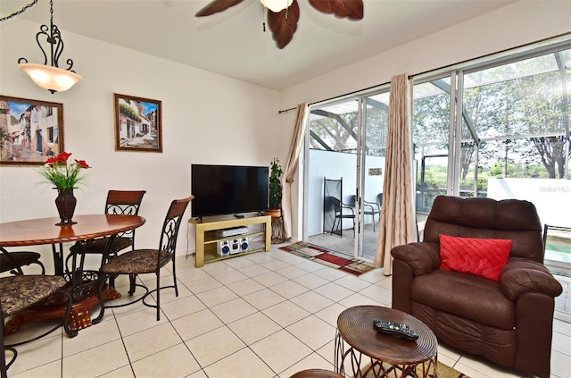 living area featuring light tile patterned flooring and ceiling fan