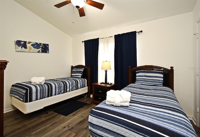 bedroom featuring vaulted ceiling, wood finished floors, and a ceiling fan