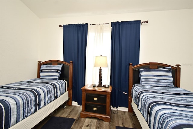 bedroom featuring wood finished floors