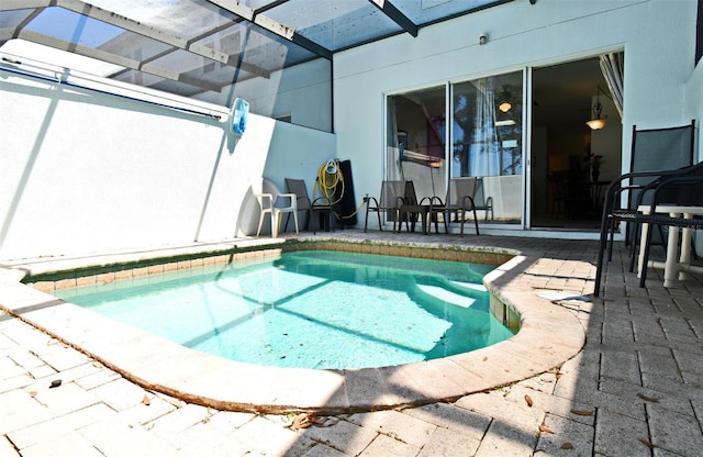 view of swimming pool featuring a patio area