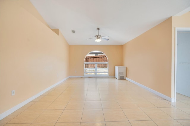 unfurnished room featuring baseboards, visible vents, ceiling fan, and light tile patterned floors