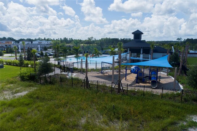 pool with playground community and fence