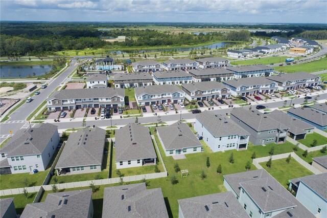 aerial view featuring a water view and a residential view
