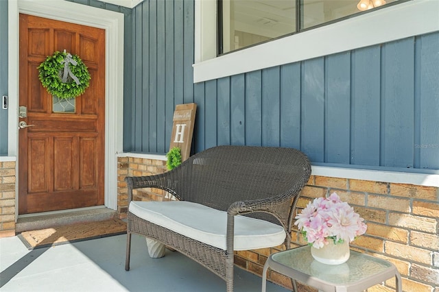 entrance to property featuring board and batten siding