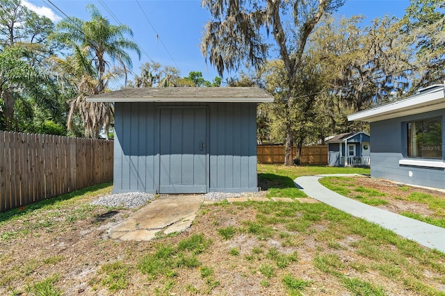 view of shed featuring a fenced backyard