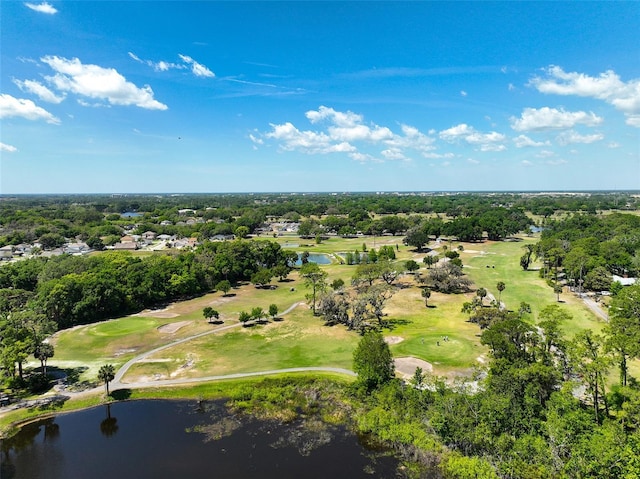 drone / aerial view featuring view of golf course and a water view