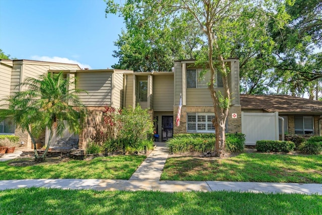 487 Oak Haven Dr Unit 487, Altamonte Springs, FL 32701 - view of front of property featuring brick siding, fence, and a front lawn