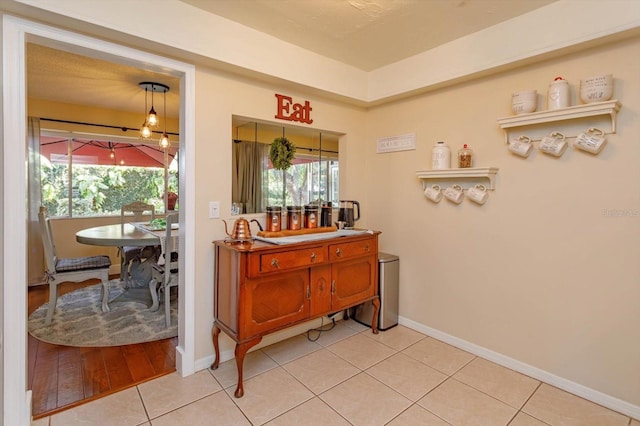 487 Oak Haven Dr Unit 487, Altamonte Springs, FL 32701 - bar with baseboards and light tile patterned flooring