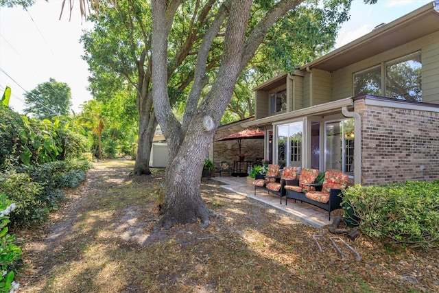 487 Oak Haven Dr Unit 487, Altamonte Springs, FL 32701 - view of yard featuring an outdoor living space and a patio area