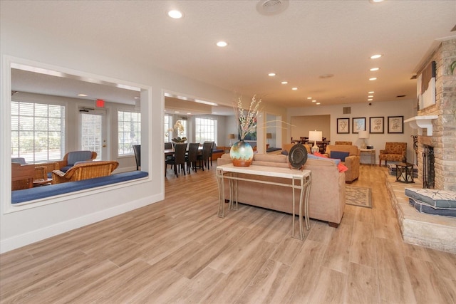 487 Oak Haven Dr Unit 487, Altamonte Springs, FL 32701 - living room featuring a stone fireplace, recessed lighting, baseboards, and light wood-type flooring