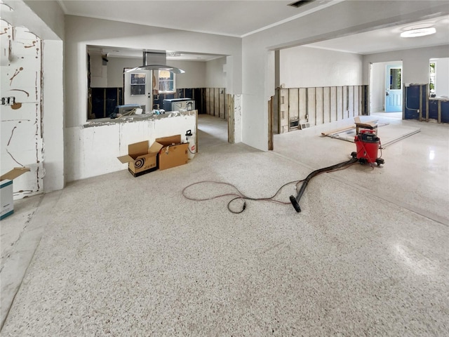 2826 46th St S, Gulfport, FL 33711 - living room featuring visible vents, ornamental molding, and speckled floor