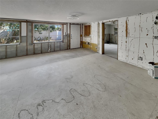 2826 46th St S, Gulfport, FL 33711 - empty room with a textured ceiling and unfinished concrete floors