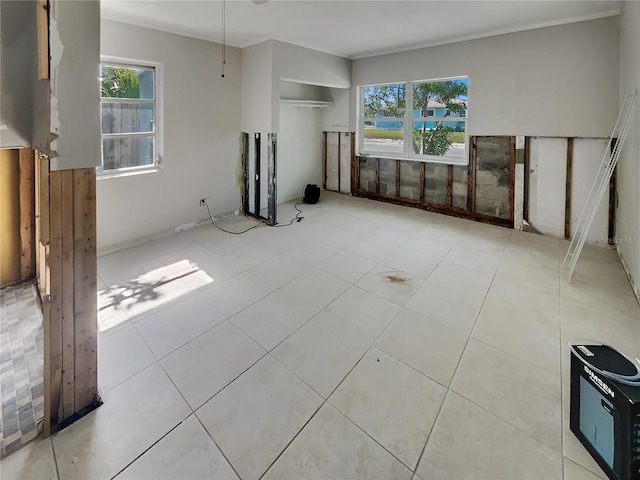 2826 46th St S, Gulfport, FL 33711 - unfurnished living room with tile patterned floors and a healthy amount of sunlight
