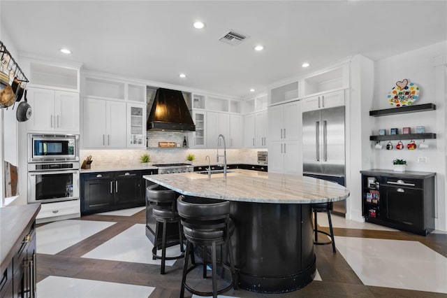 1224 Union Club Dr, Winter Garden, FL 34787 - kitchen with built in appliances, a sink, premium range hood, recessed lighting, and open shelves