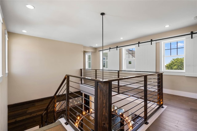 1224 Union Club Dr, Winter Garden, FL 34787 - staircase with wood-type flooring, a barn door, baseboards, and recessed lighting