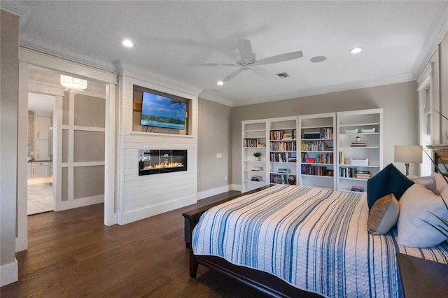 1224 Union Club Dr, Winter Garden, FL 34787 - bedroom with ornamental molding, wood finished floors, a large fireplace, baseboards, and recessed lighting