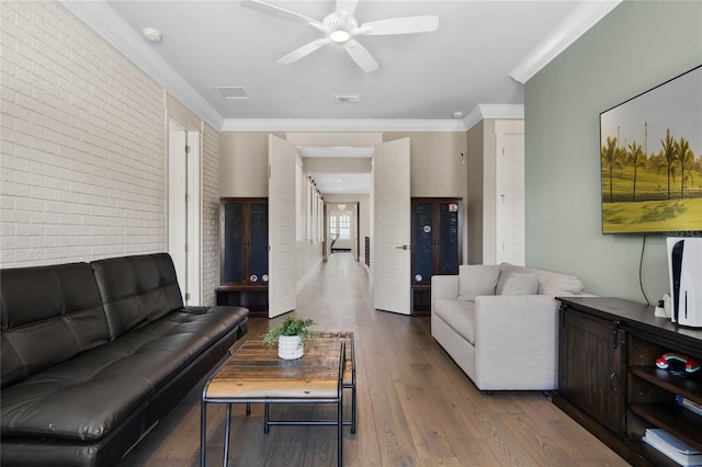 1224 Union Club Dr, Winter Garden, FL 34787 - living room featuring brick wall, wood finished floors, crown molding, and a ceiling fan