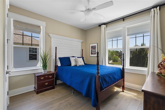 1224 Union Club Dr, Winter Garden, FL 34787 - bedroom featuring wood-type flooring, multiple windows, baseboards, and a ceiling fan