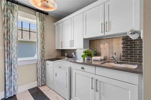 1224 Union Club Dr, Winter Garden, FL 34787 - laundry area with washing machine and clothes dryer, cabinet space, and baseboards