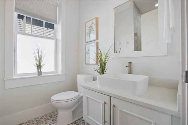 1224 Union Club Dr, Winter Garden, FL 34787 - bathroom featuring healthy amount of natural light, vanity, toilet, and baseboards