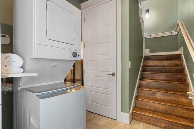 1224 Union Club Dr, Winter Garden, FL 34787 - laundry room featuring stacked washer / drying machine, baseboards, and light tile patterned flooring