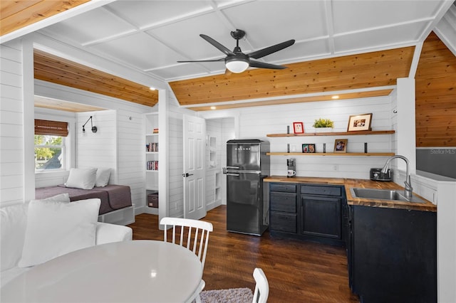 1224 Union Club Dr, Winter Garden, FL 34787 - kitchen with freestanding refrigerator, a sink, wooden walls, open shelves, and ceiling fan