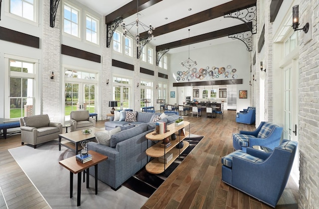 1224 Union Club Dr, Winter Garden, FL 34787 - living area with a towering ceiling, a chandelier, wood finished floors, and beamed ceiling